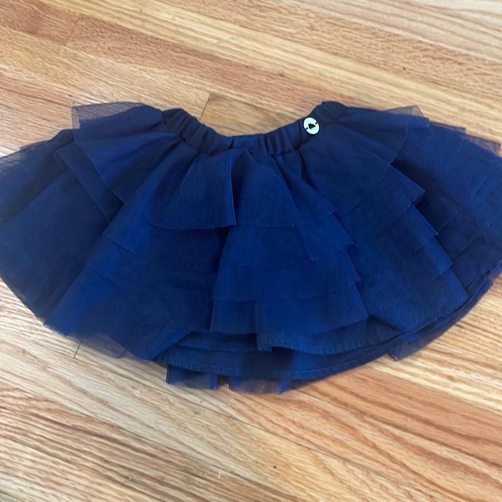 Navy blue ruffle Mayoral skirt. Never worn. Great condition.